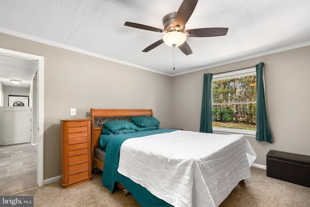 carpeted bedroom featuring a textured ceiling, ceiling fan, and ornamental molding