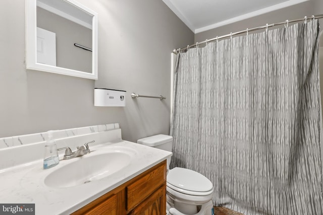 bathroom featuring vanity, toilet, ornamental molding, and walk in shower