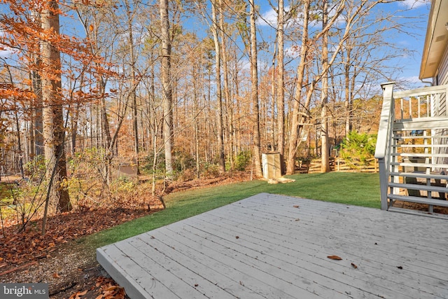 wooden terrace with a yard