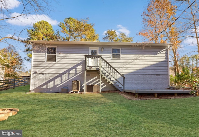 back of property featuring a yard