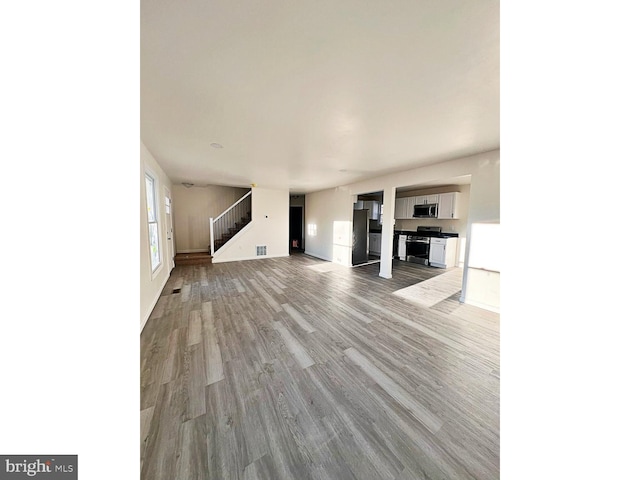 unfurnished living room featuring light hardwood / wood-style floors