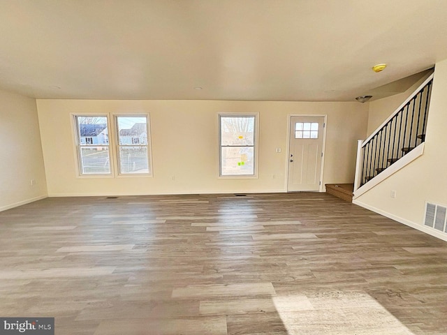 foyer featuring a wealth of natural light and light hardwood / wood-style flooring