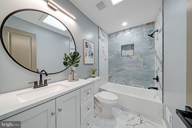 full bathroom featuring vanity, toilet, and tiled shower / bath