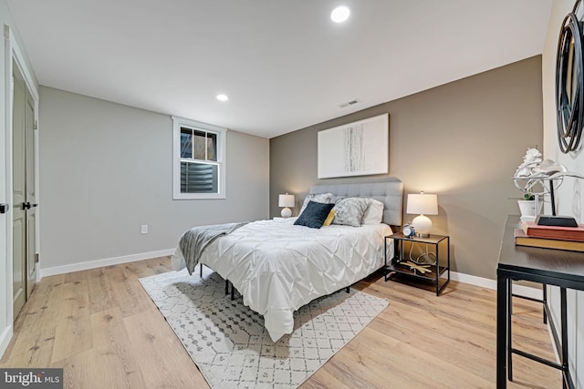 bedroom featuring light hardwood / wood-style floors