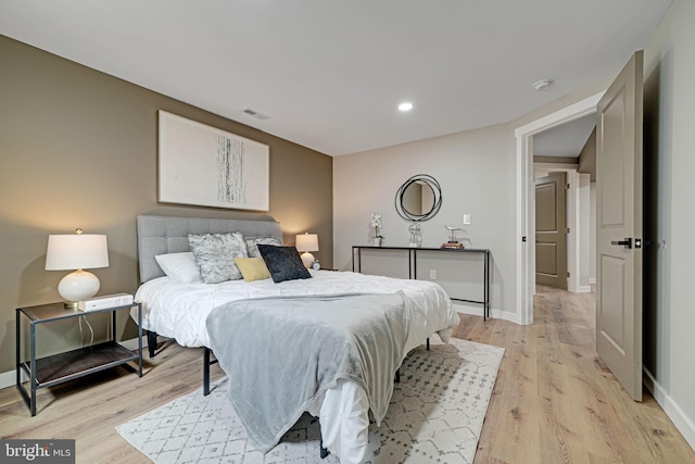 bedroom with light hardwood / wood-style floors