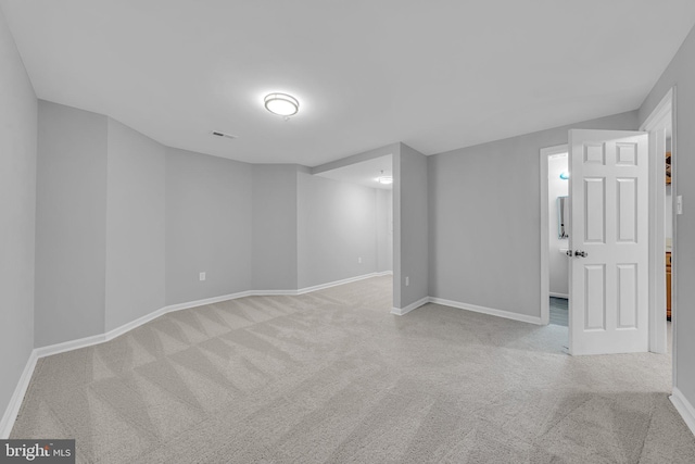 basement with light colored carpet