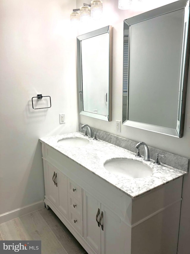 bathroom featuring vanity and hardwood / wood-style flooring