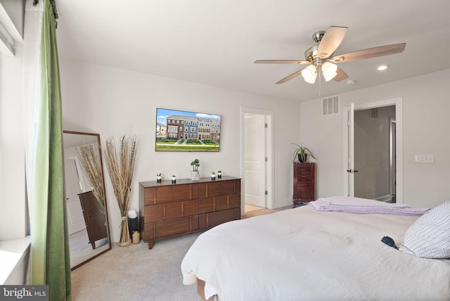 bedroom with light colored carpet, visible vents, ceiling fan, and recessed lighting