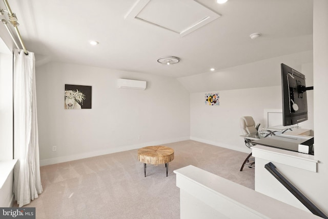 office space with lofted ceiling, carpet flooring, baseboards, a wall mounted air conditioner, and attic access