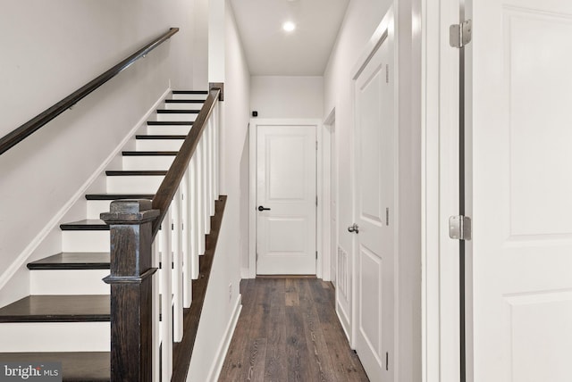 stairs with recessed lighting, baseboards, and wood finished floors