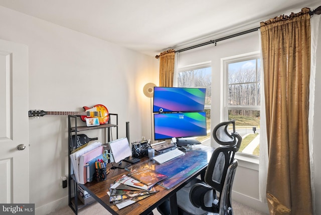 office area featuring plenty of natural light and baseboards