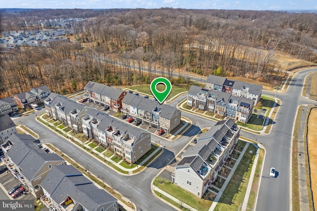 aerial view with a residential view and a wooded view