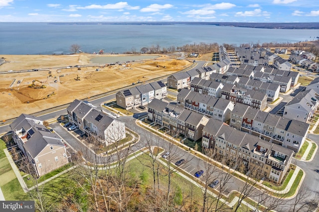 birds eye view of property featuring a water view and a residential view