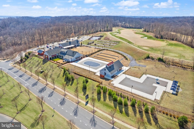 bird's eye view featuring a wooded view