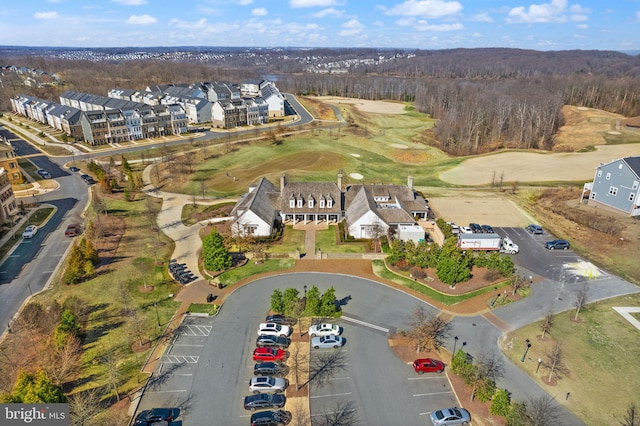 bird's eye view with view of golf course and a residential view