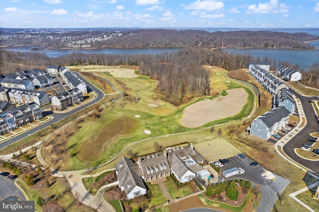 bird's eye view with golf course view and a water view