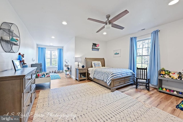 bedroom featuring light wood-type flooring and ceiling fan