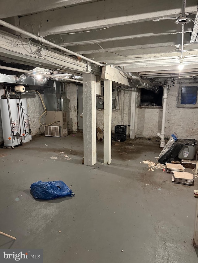 basement featuring heating unit and gas water heater