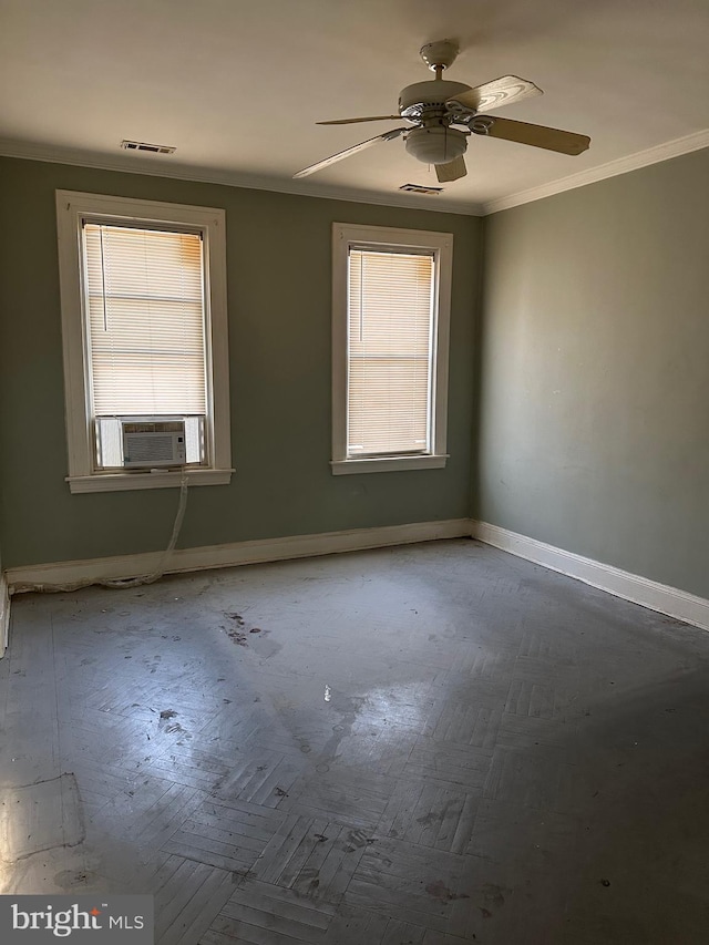 empty room with parquet floors, crown molding, plenty of natural light, and ceiling fan