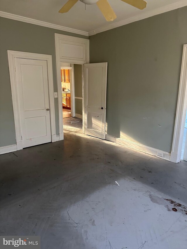 unfurnished bedroom with concrete flooring, crown molding, and ceiling fan