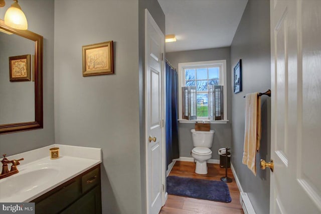 bathroom featuring hardwood / wood-style floors, vanity, and toilet