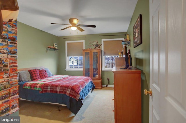 carpeted bedroom with ceiling fan