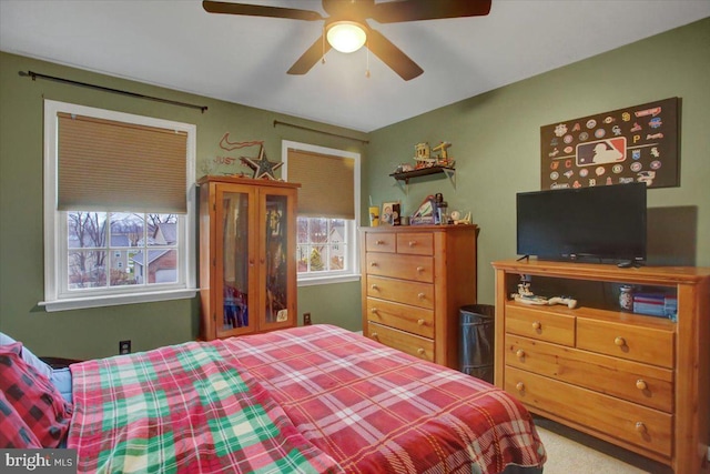 carpeted bedroom featuring ceiling fan