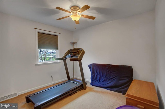 exercise area featuring carpet and ceiling fan