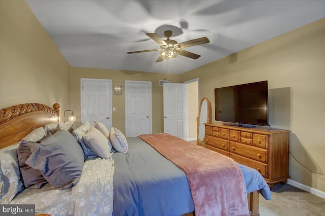 bedroom featuring ceiling fan and light carpet