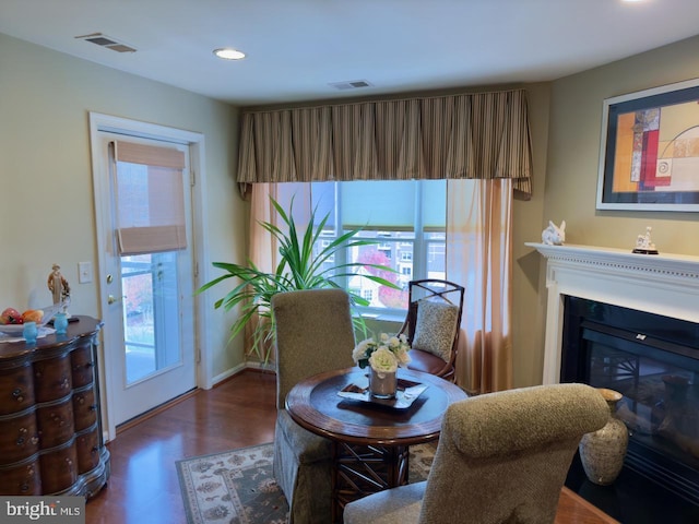 dining room with dark hardwood / wood-style flooring