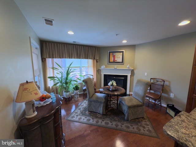 sitting room featuring dark hardwood / wood-style floors