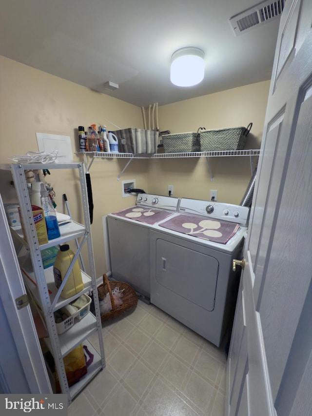 laundry area with separate washer and dryer