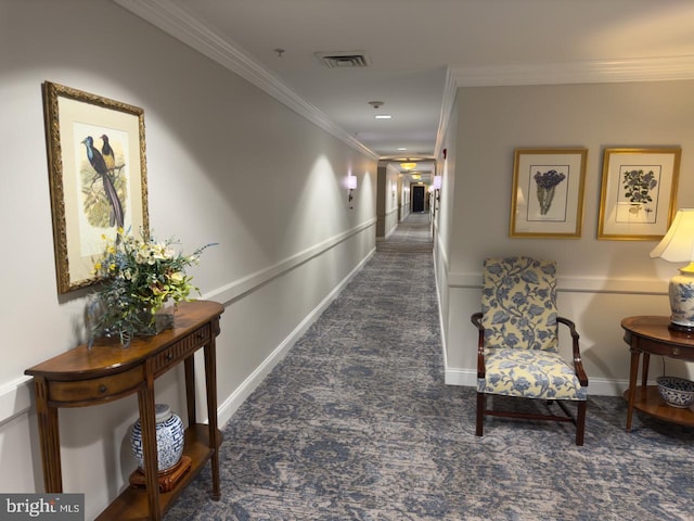 hall with crown molding and dark carpet