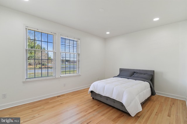 bedroom with light hardwood / wood-style flooring