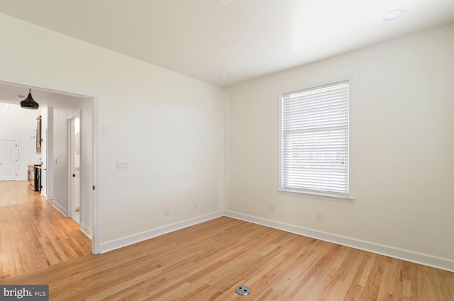 empty room featuring light hardwood / wood-style floors and a healthy amount of sunlight