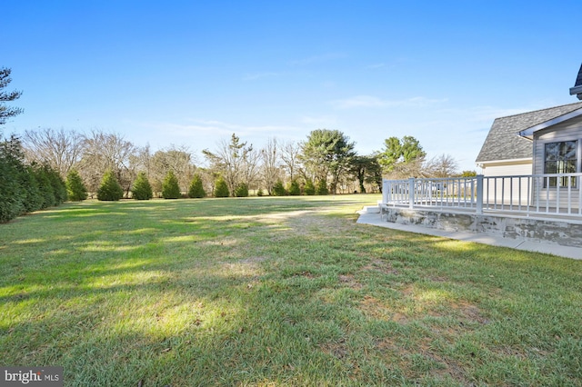 view of yard with a wooden deck