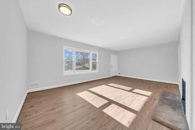 empty room with hardwood / wood-style flooring