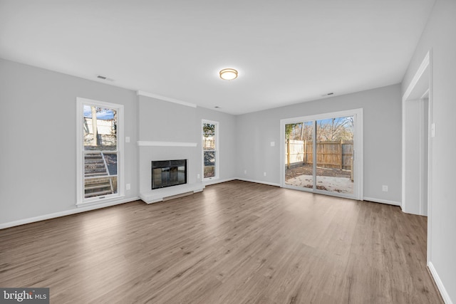 unfurnished living room featuring light hardwood / wood-style flooring