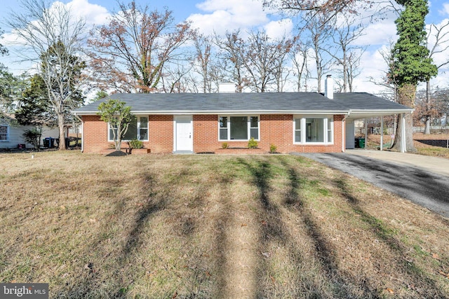 ranch-style house with a front lawn and a carport