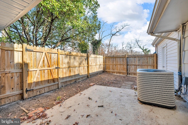 view of yard featuring central AC unit and a patio area