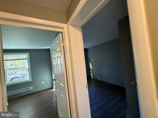 hallway featuring dark hardwood / wood-style floors and a baseboard heating unit