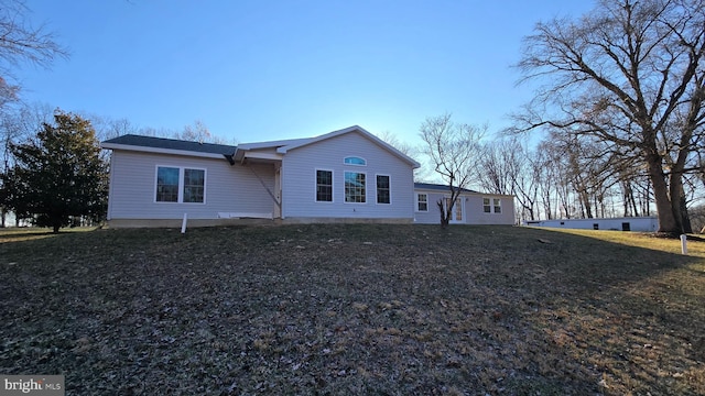 view of side of home featuring a yard