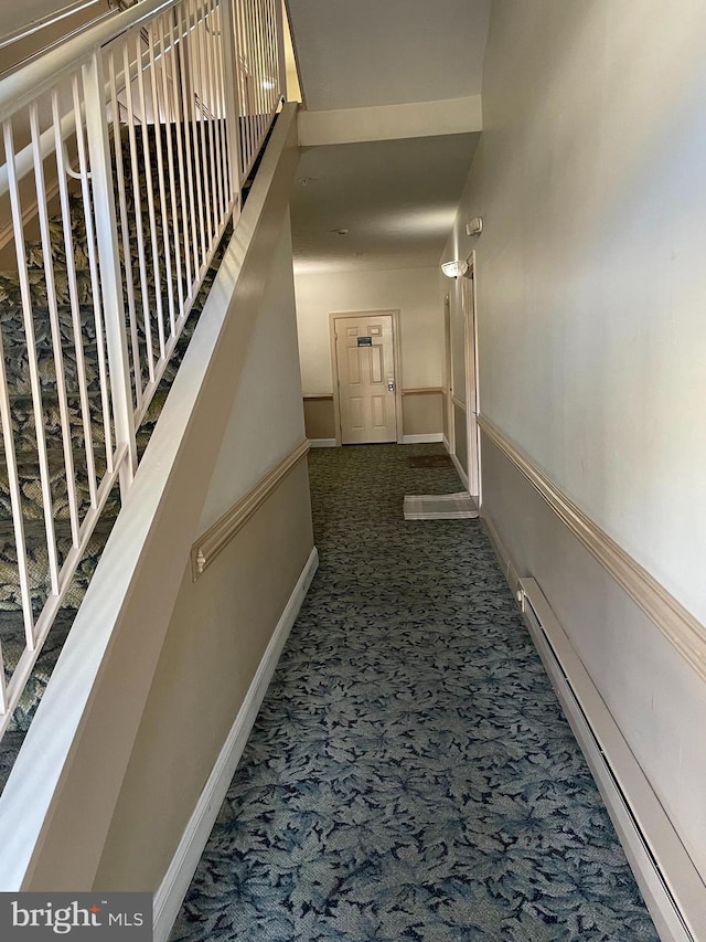 hall with carpet flooring and a baseboard radiator