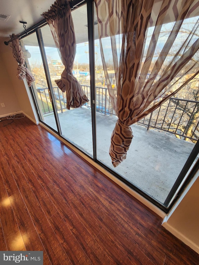 spare room featuring hardwood / wood-style flooring