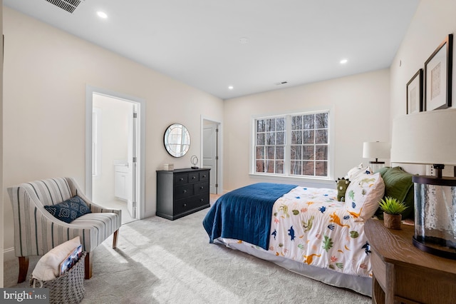 bedroom featuring light carpet