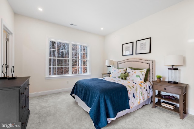 bedroom featuring light colored carpet