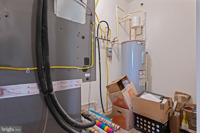 utility room featuring electric water heater