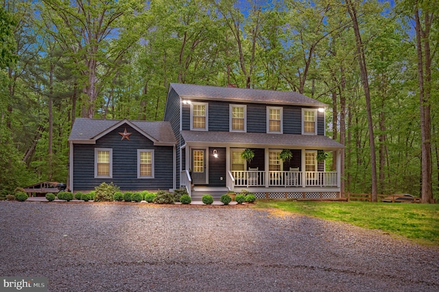 colonial house featuring covered porch