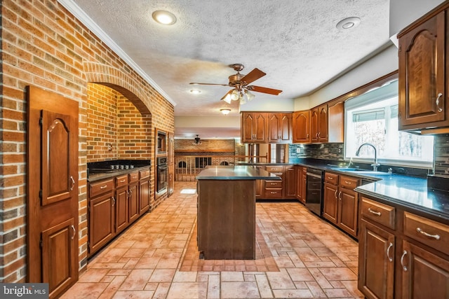 kitchen with sink, ceiling fan, backsplash, black appliances, and a kitchen island