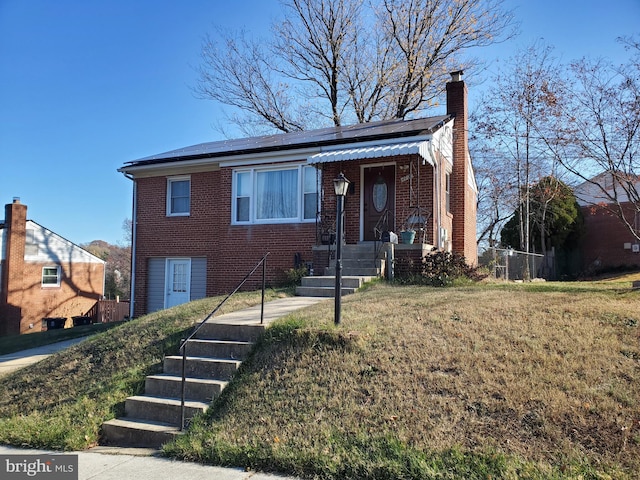 view of front facade featuring a front yard